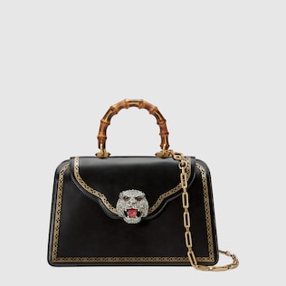 Frame print leather top handle bag