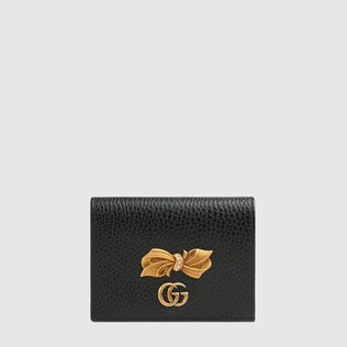 Leather card case with bow