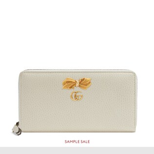 Leather zip around wallet with bow