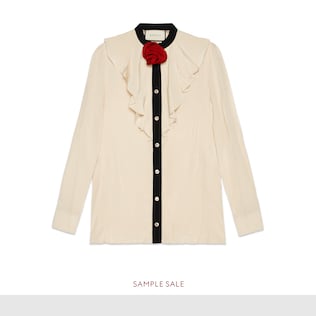 Silk shirt with rose brooch