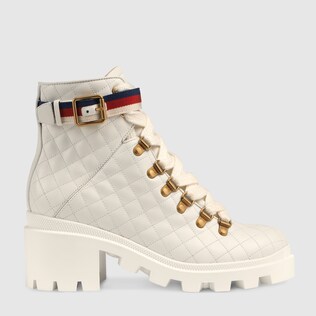 Quilted leather ankle boot with belt