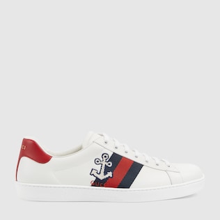 white gucci shoes with red gs