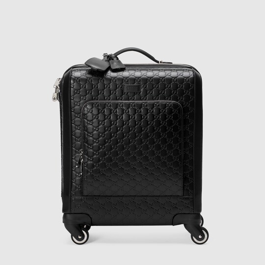 black gucci luggage