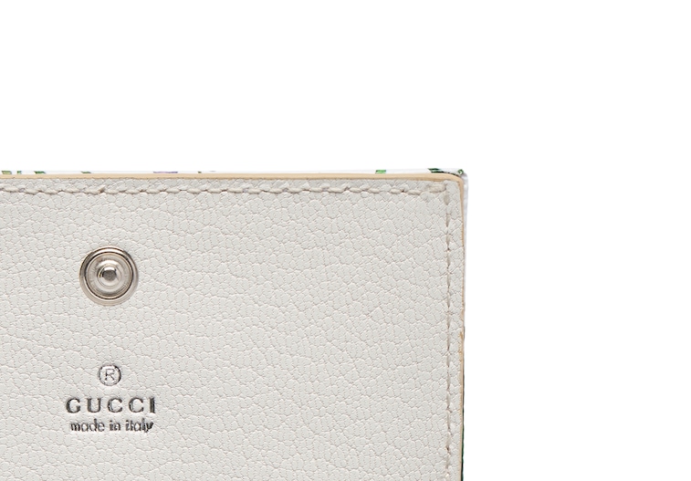 Flora-motif bi-fold card case in white and multicolor canvas