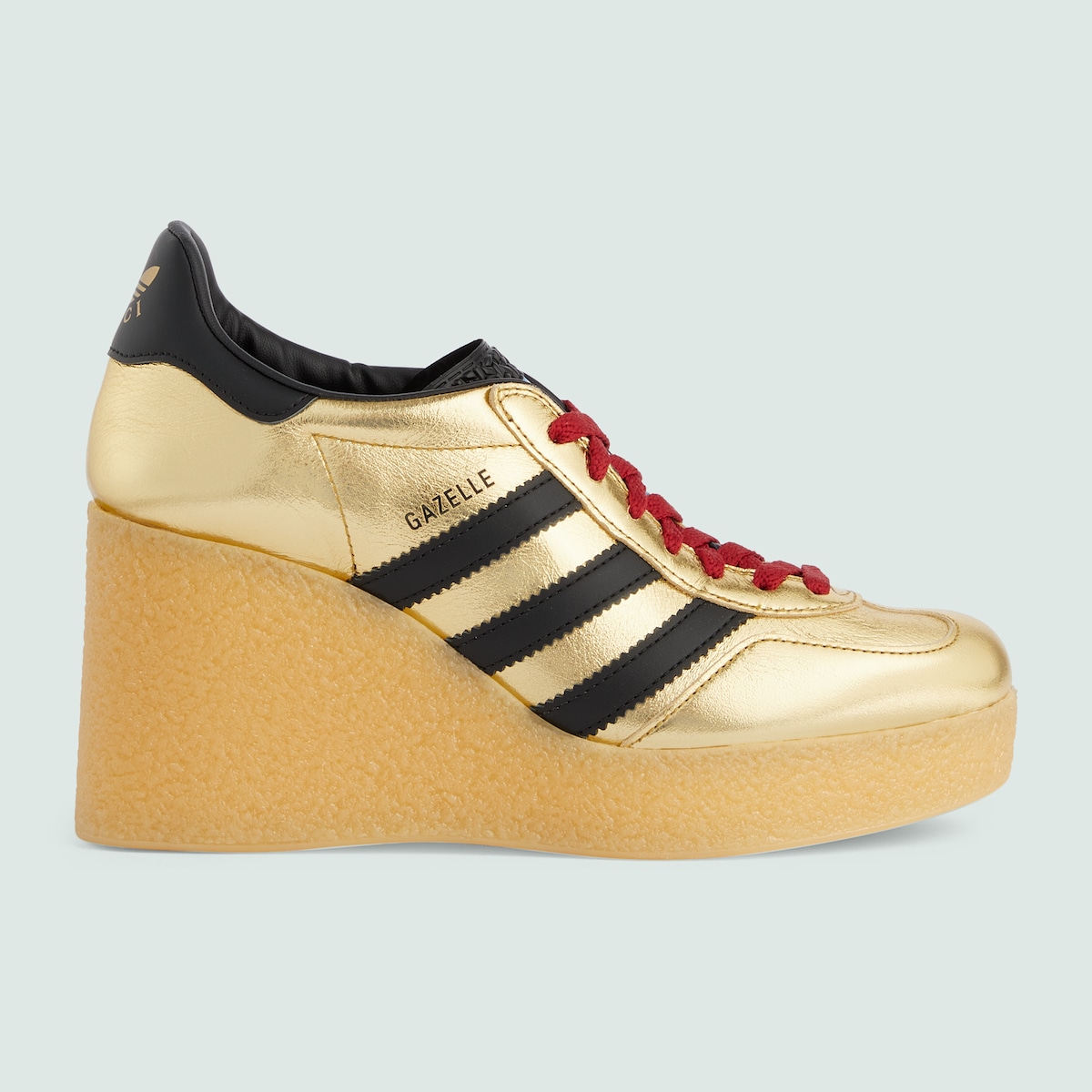 Sneaker Gazzelle con plateau adidas x Gucci in pelle metallizzata oro