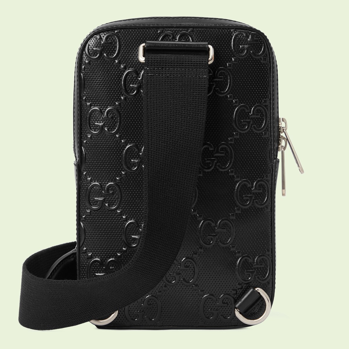 GG embossed sling backpack in black leather GUCCI® US