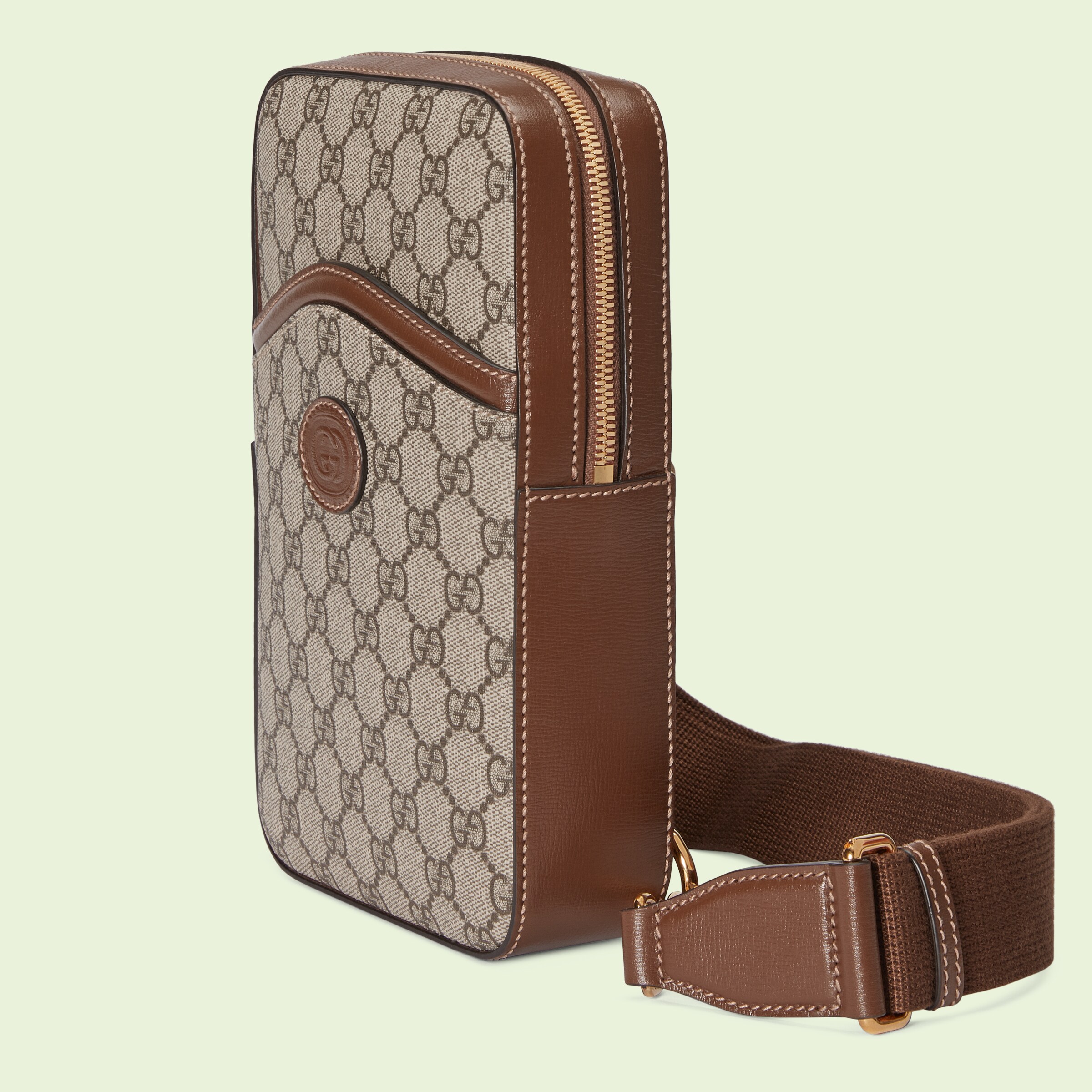 Sling backpack with Interlocking G in beige and ebony Supreme GUCCI® US