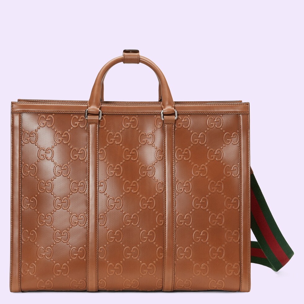 GG embossed tote bag in brown leather GUCCI® AE