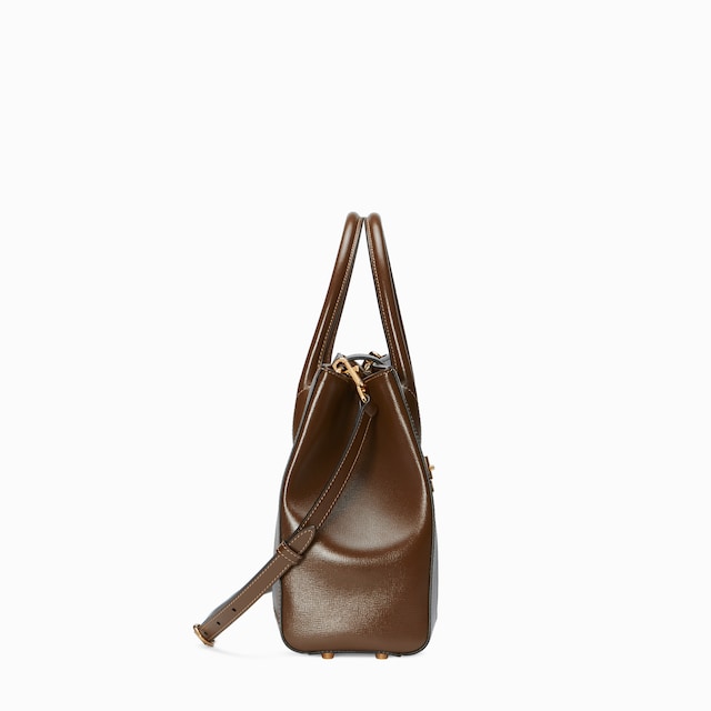 Medium tote bag with piston closure