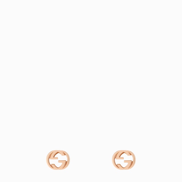 Gucci Interlocking stud earrings in 18k yellow gold | GUCCI® US