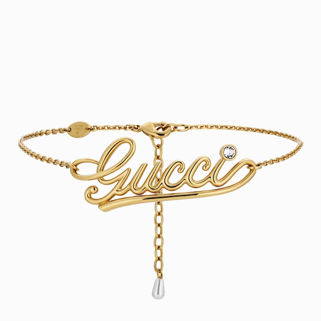 Колье-чокер с надписью «Gucci»