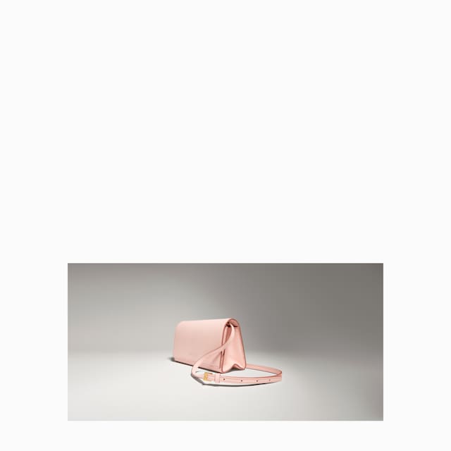 Mini pouch with Gucci lettering