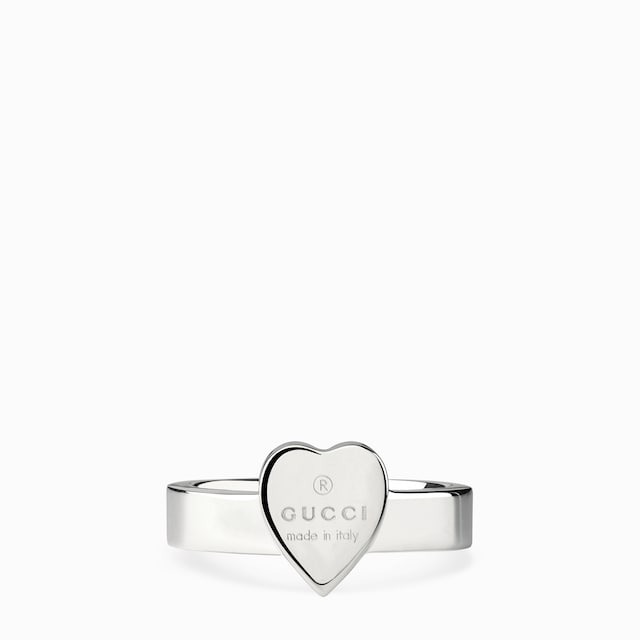 Trademark ring with heart pendant
