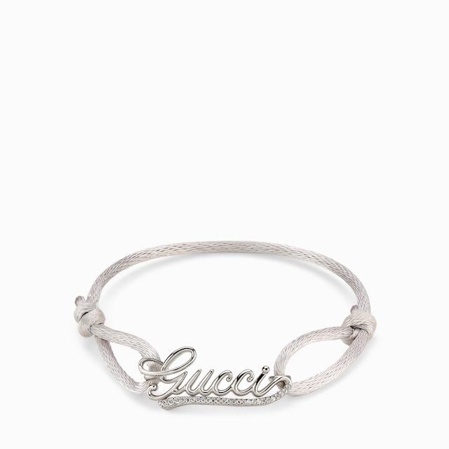 Bracelet cordon avec inscription Gucci et cristaux