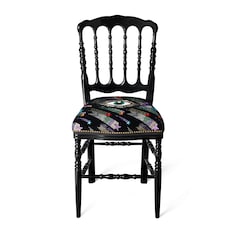 Wood chair with eye embroidery