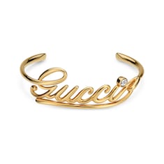 Bracciale rigido con scritta Gucci