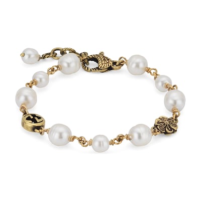 Bracciale con perle e fiore GG in metallo color oro GUCCI Italia