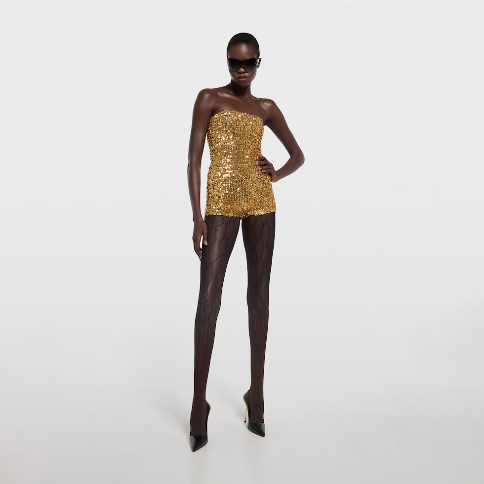 Tuta in tessuto elastico con paillette ricamate