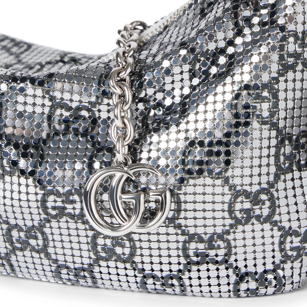 Metallic evening bag with charm