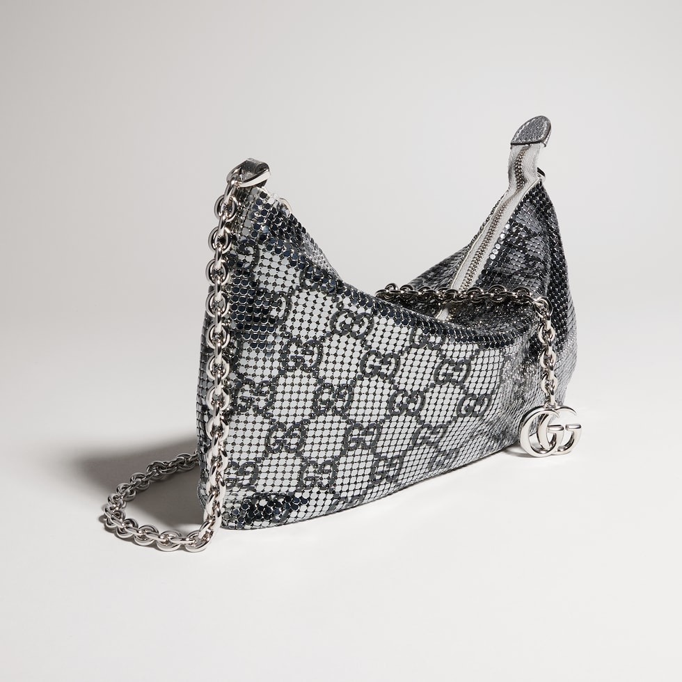 Metallic evening bag with charm