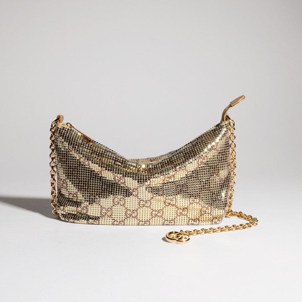 Metallic evening bag with charm