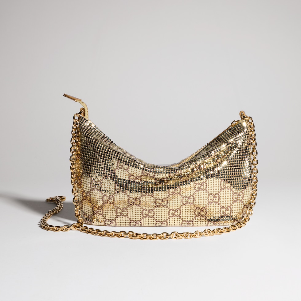 Metallic evening bag with charm