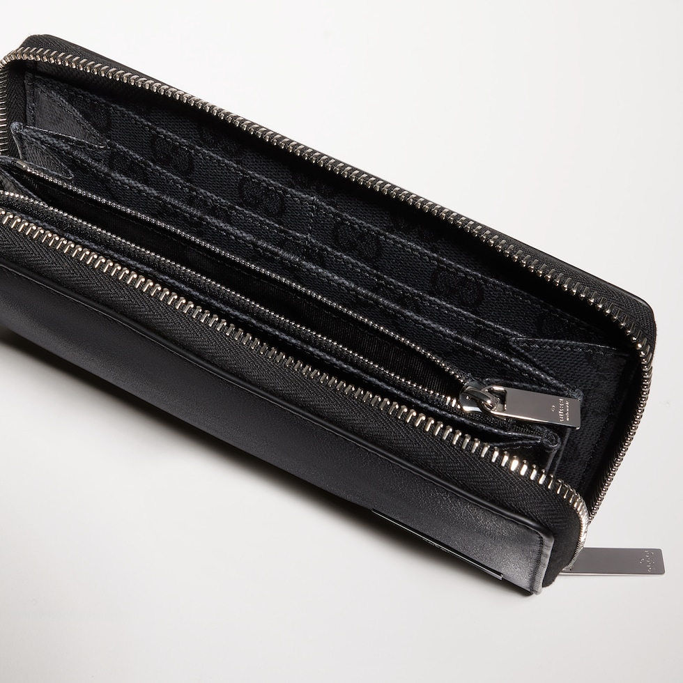 Zip around wallet with metal tag
