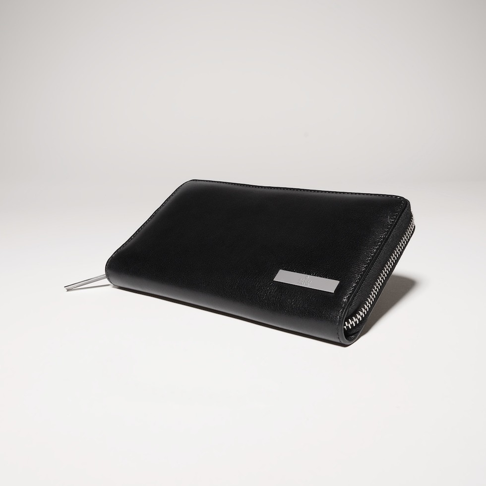 Zip around wallet with metal tag