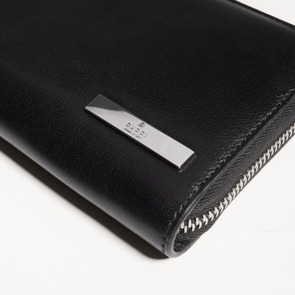 Zip around wallet with metal tag