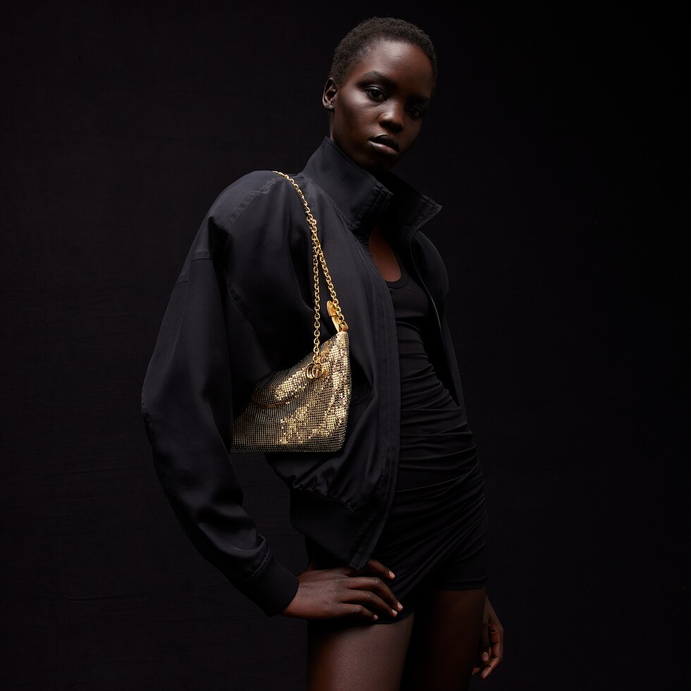 Metallic evening bag with charm