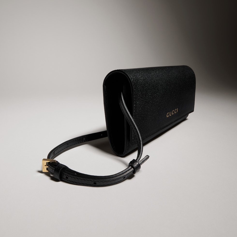 Wallet with strap and Gucci lettering