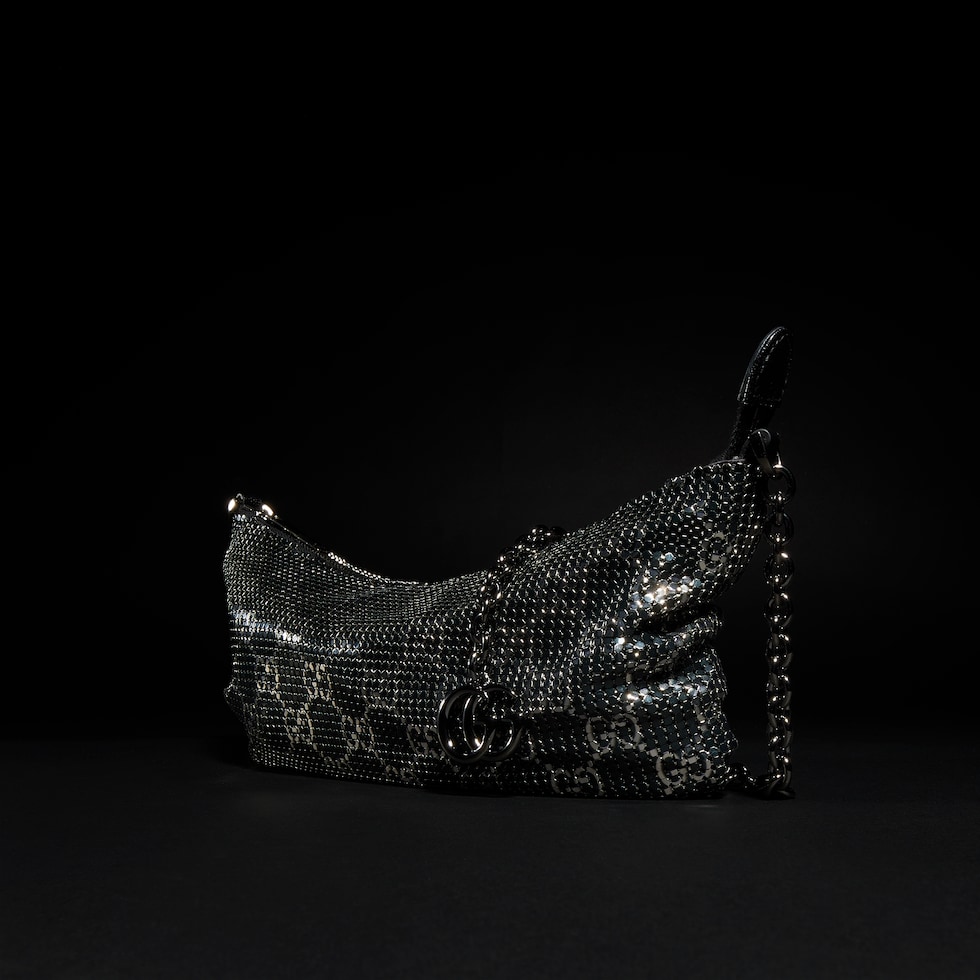 Metallic evening bag with charm