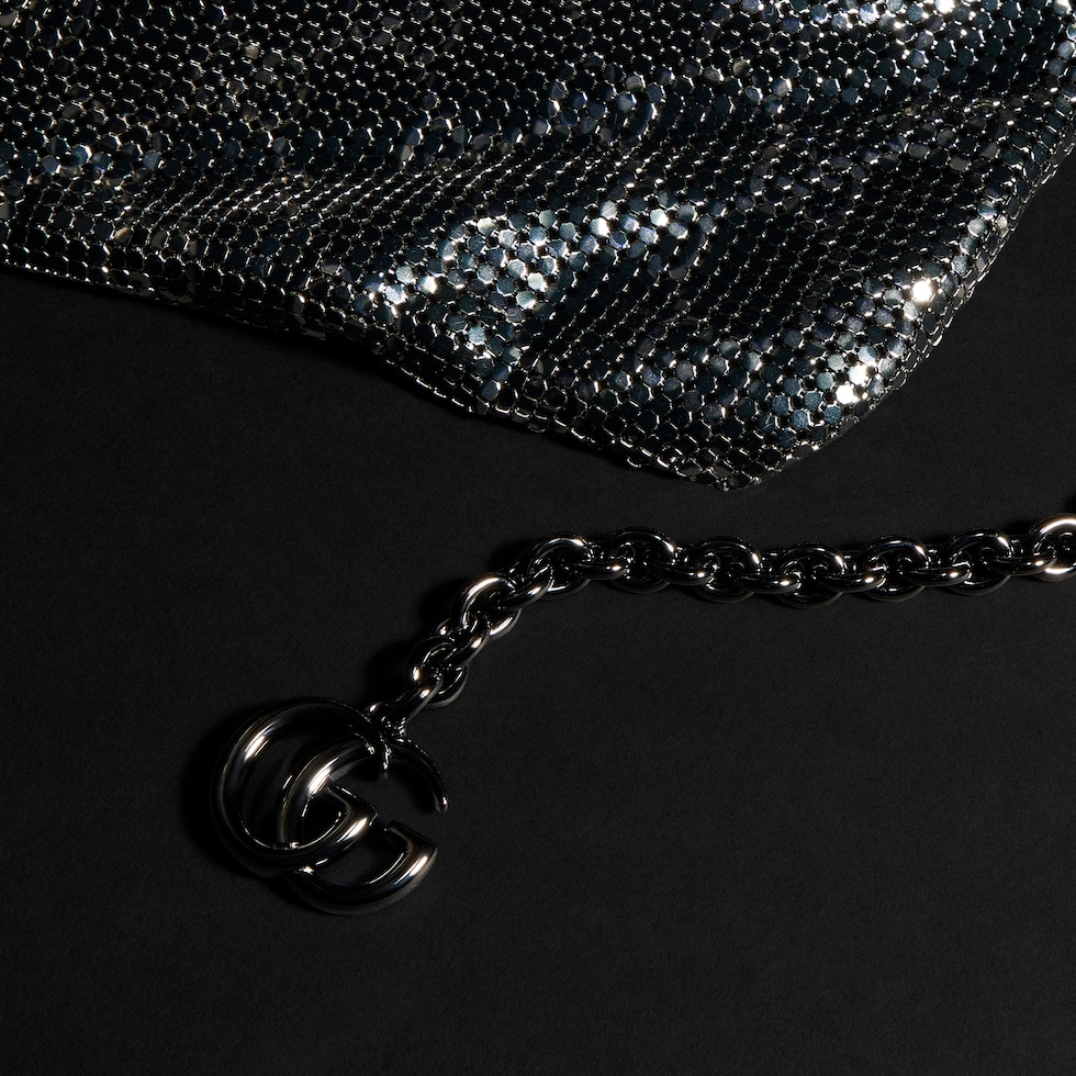 Metallic evening bag with charm