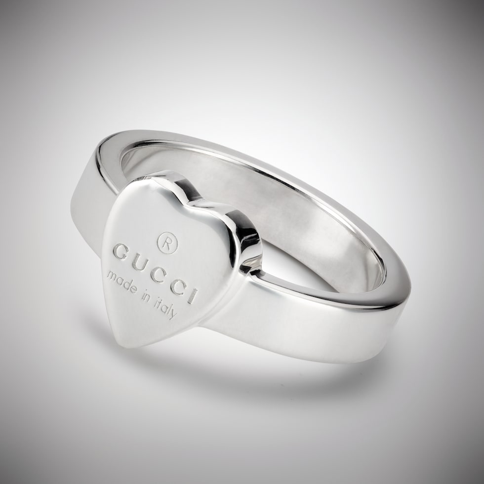 Trademark ring with heart pendant