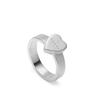 Trademark ring with heart pendant