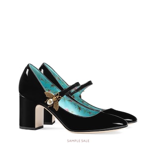 Patent leather mid-heel pump with bee