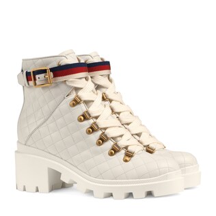 Quilted leather ankle boot with belt