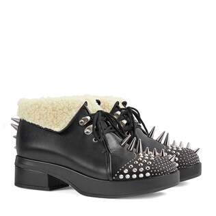 Leather bootie with spikes and studs
