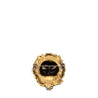 Lion head brooch with glass stone 