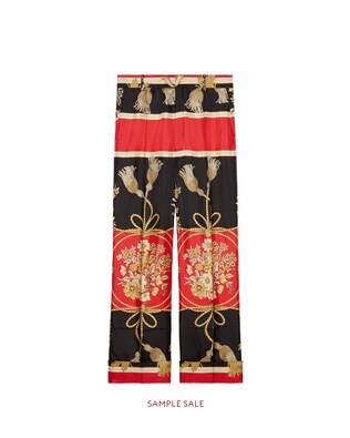 Silk pant with flowers and tassels