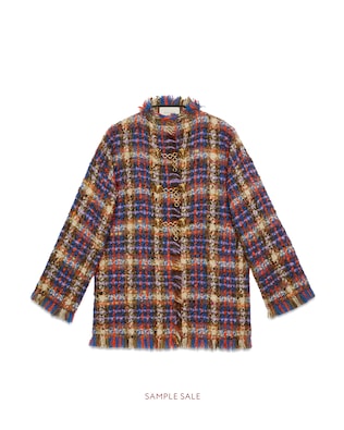 Tweed jacket with lion head toggles